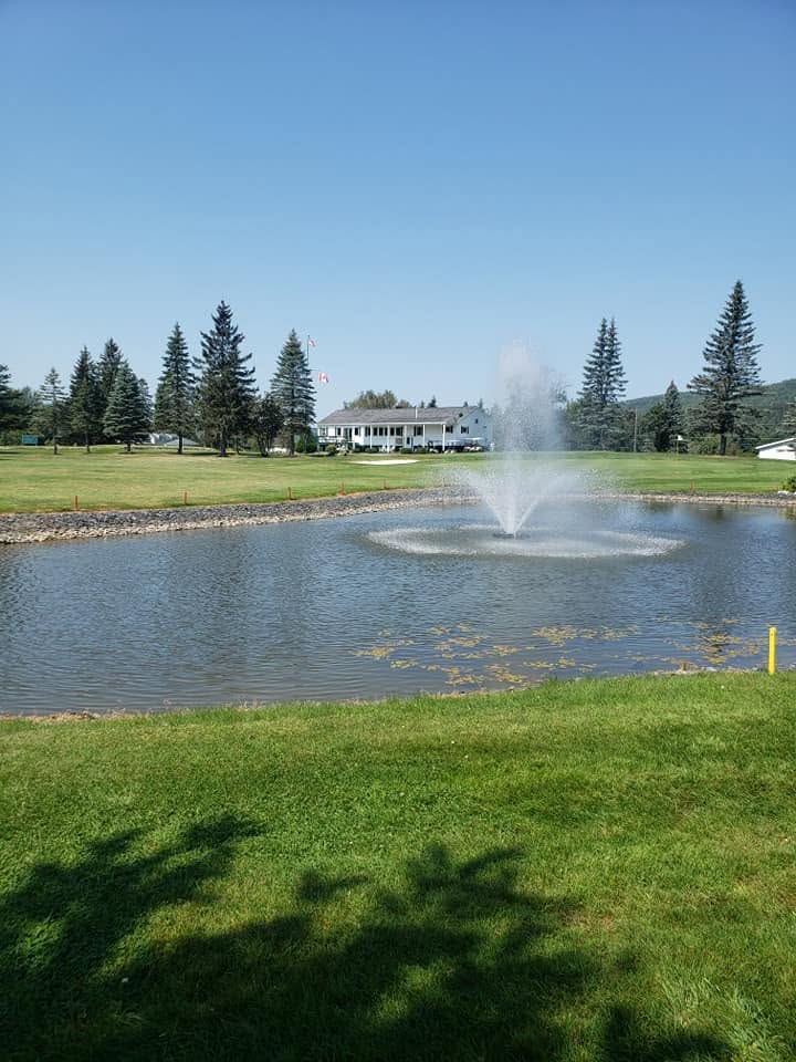Fort Kent Golf Course pond and clubhouse